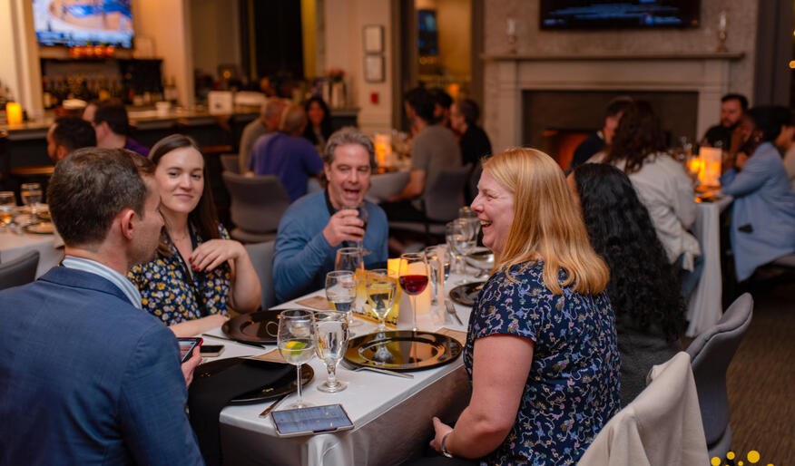 Attendees sharing dinner during the event