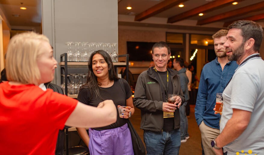 Attendees connecting over drinks