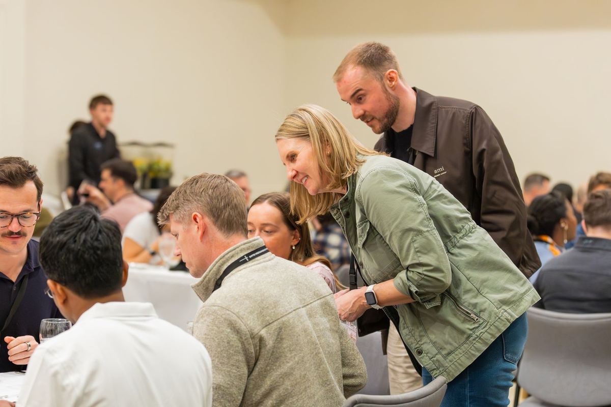 Attendees sharing dinner during the event